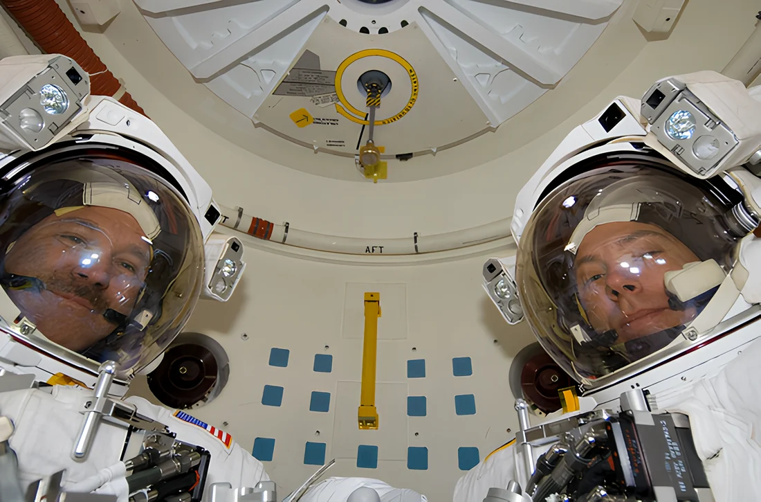 The same astronaut photograph after a 4× SwinIR upscale, with restored fabric and equipment detail.
